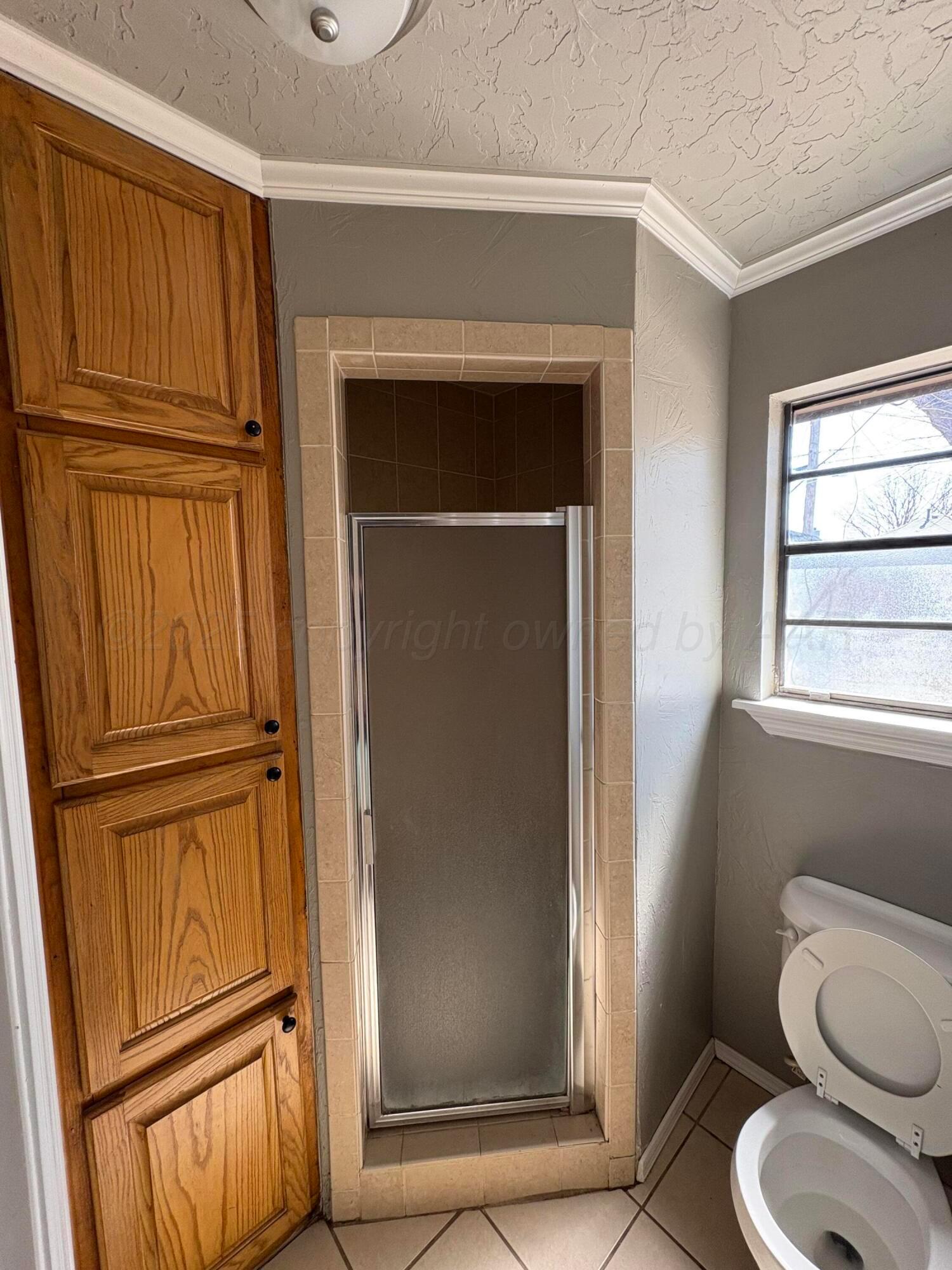 6210 Rutgers Street Amarillo, TX 79109 - Photo 8 of 13 a bathroom with a toilet