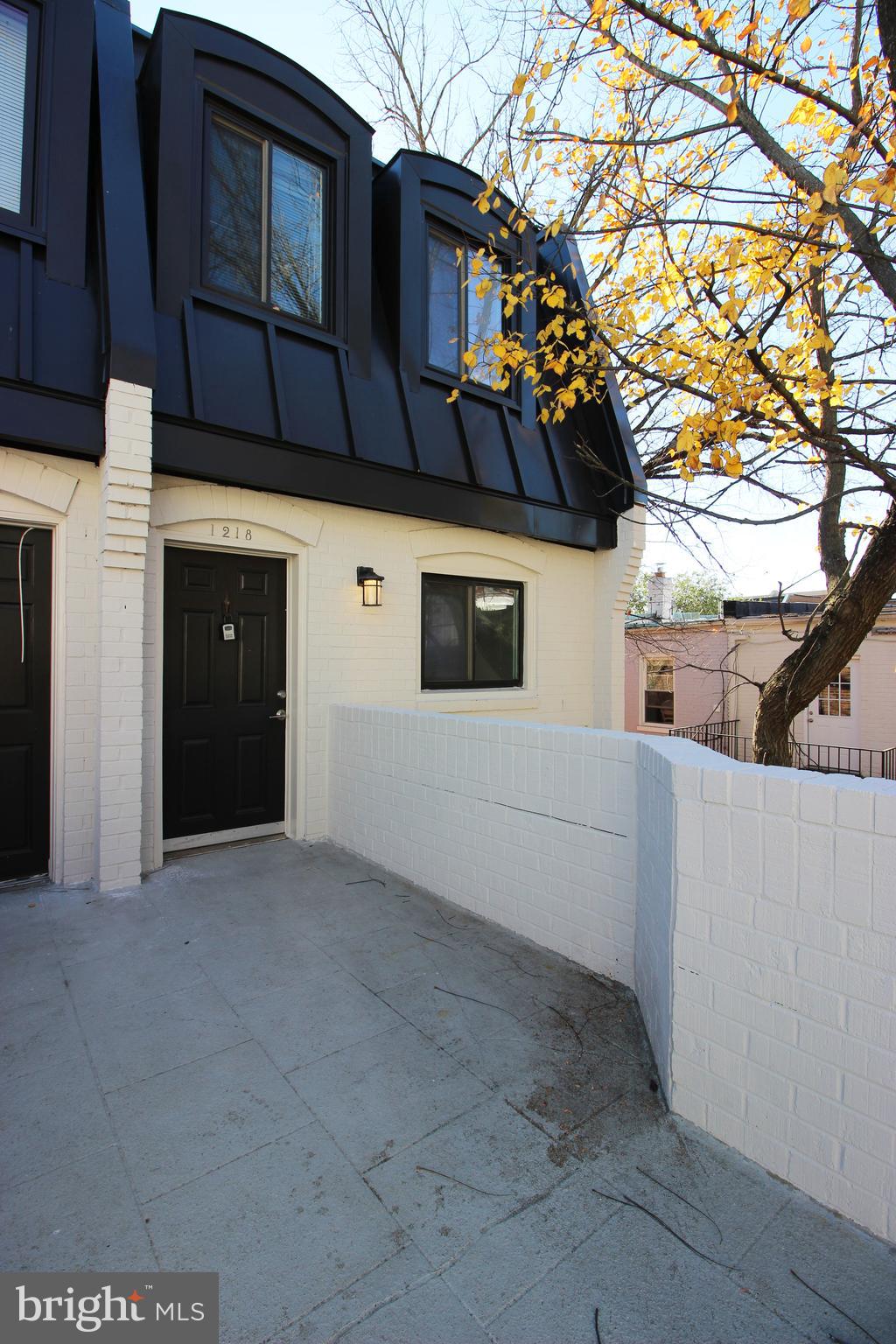 1218 Eton Court Northwest Washington, DC 20007 - Photo 1 of 22 a view of a house with a large tree
