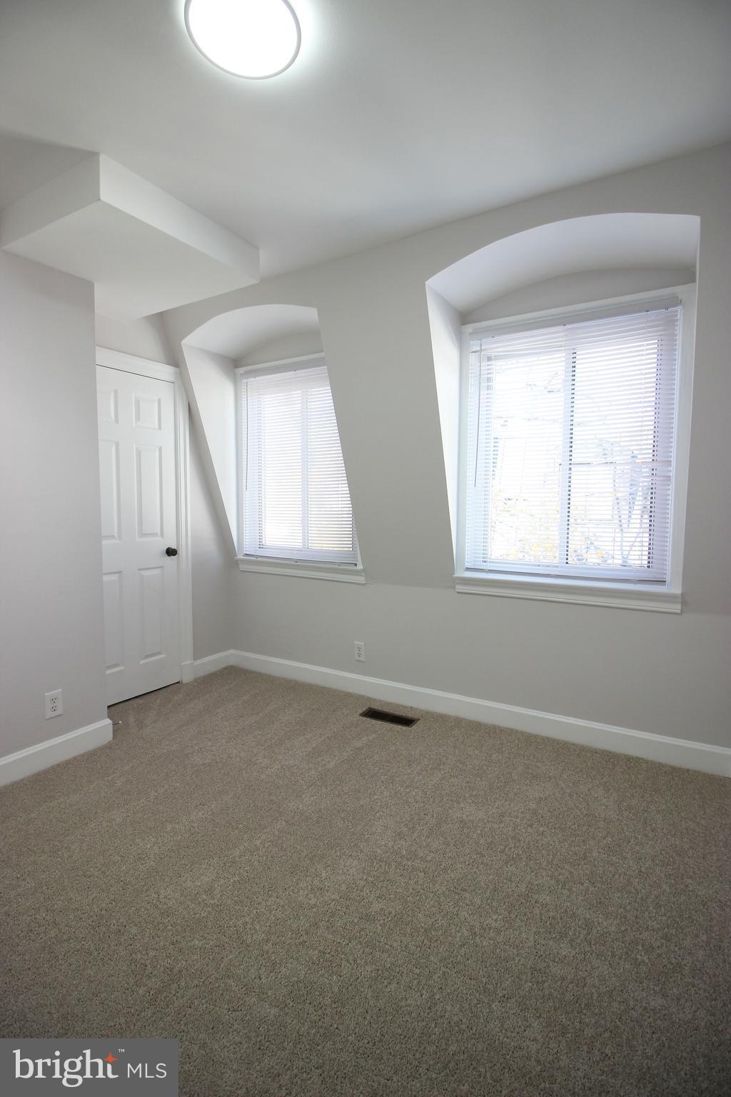 1218 Eton Court Northwest Washington, DC 20007 - Photo 9 of 22 an empty room with windows