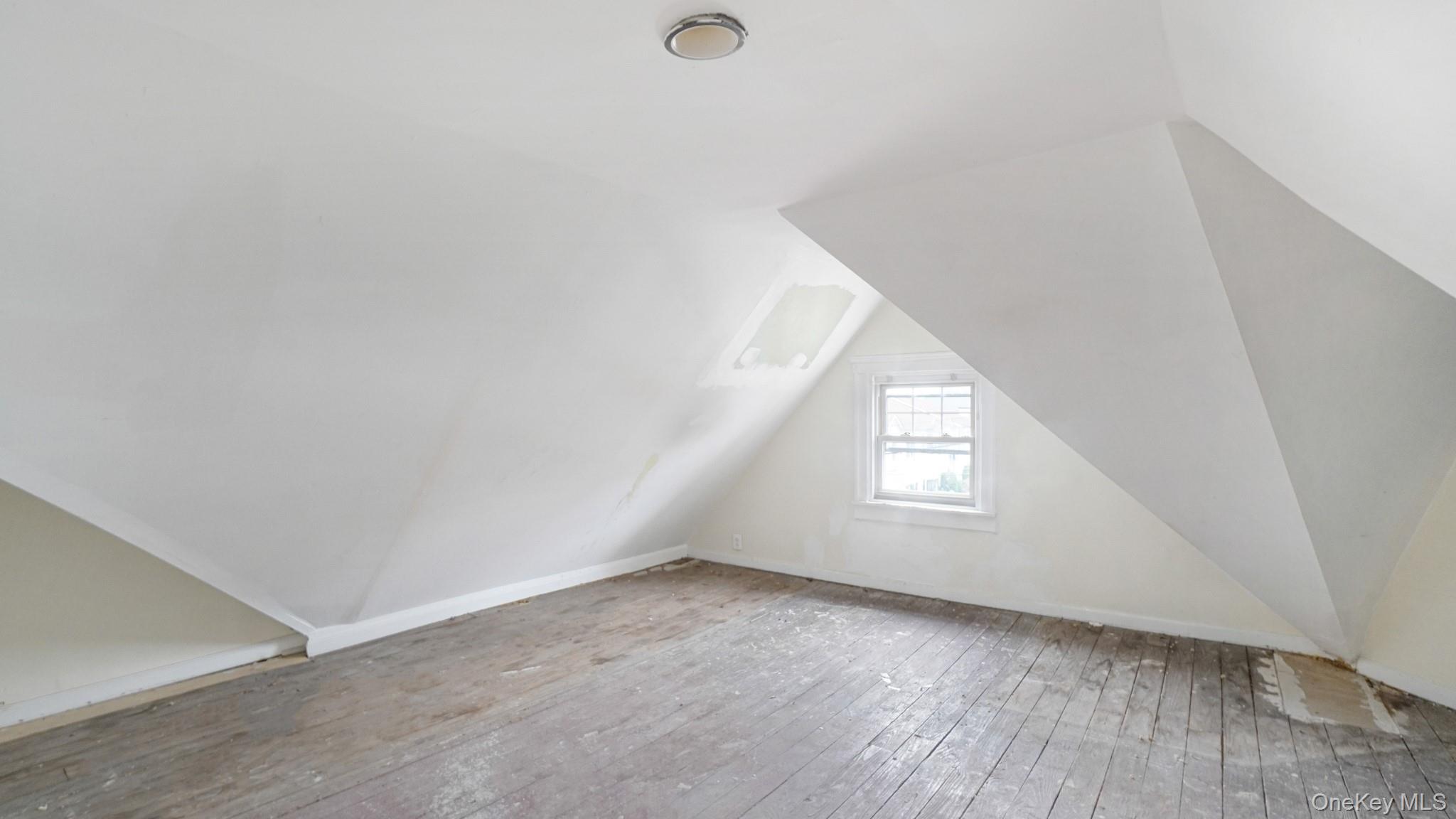 111 South Fulton Avenue Mount Vernon, NY 10550 - Photo 15 of 19 Bonus room featuring lofted ceiling and wood-type flooring