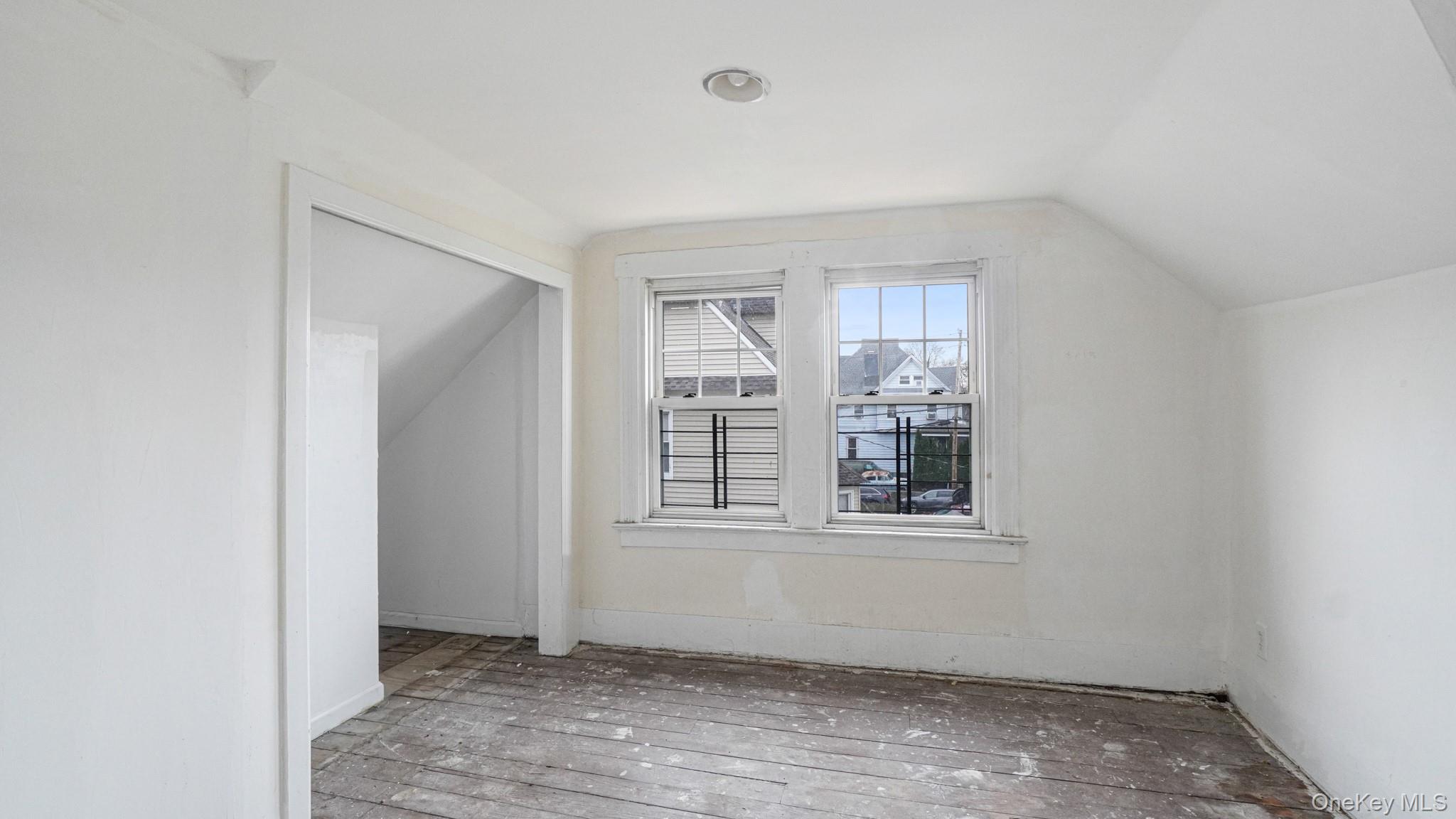 111 South Fulton Avenue Mount Vernon, NY 10550 - Photo 16 of 19 Additional living space with vaulted ceiling