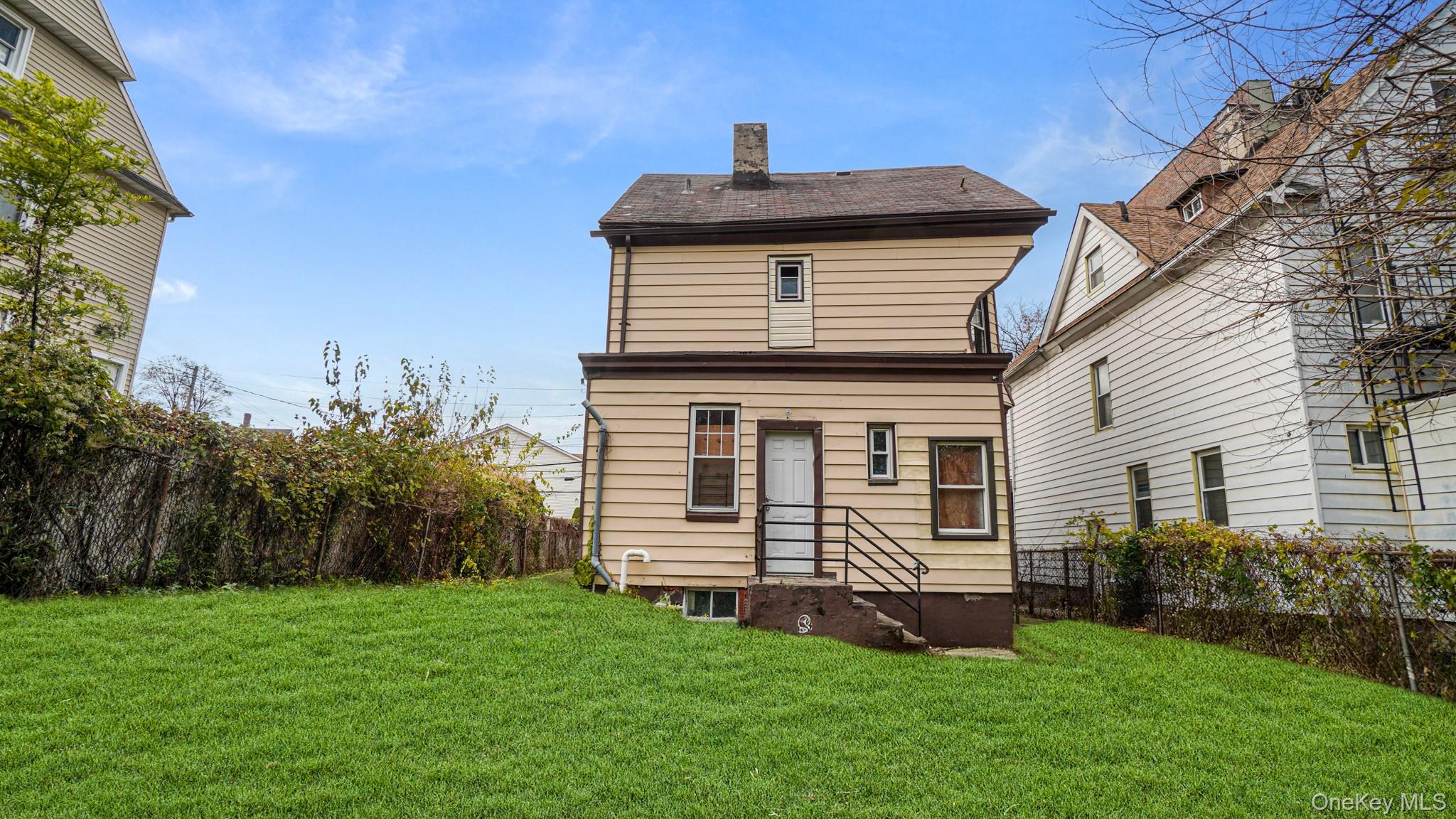 111 South Fulton Avenue Mount Vernon, NY 10550 - Photo 17 of 19 Rear view of property with a chimney