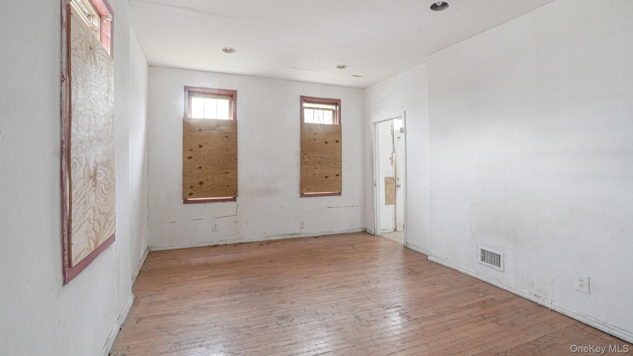 111 South Fulton Avenue Mount Vernon, NY 10550 - Photo 4 of 19 Unfurnished room featuring wood-type flooring