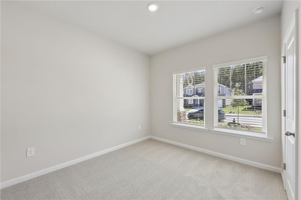 1499 High Fls Lane Grayson, GA 30017 - Photo 15 of 37 an empty room with a window