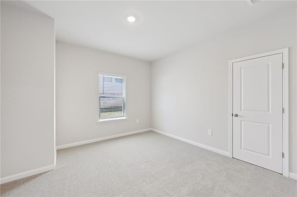 1499 High Fls Lane Grayson, GA 30017 - Photo 19 of 37 an empty room with windows