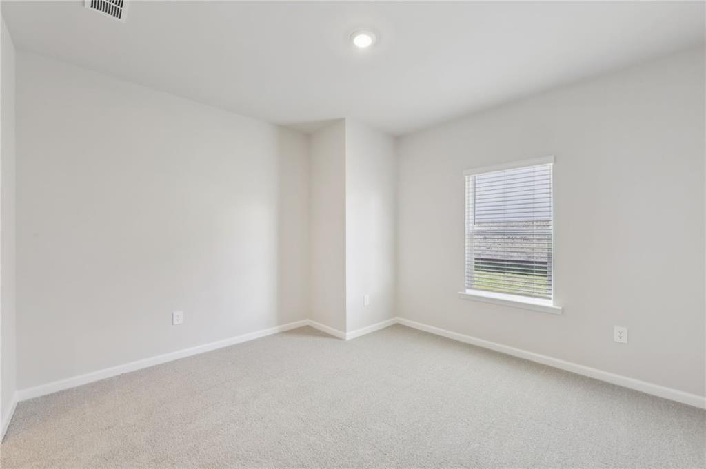 1499 High Fls Lane Grayson, GA 30017 - Photo 20 of 37 an empty room with a window