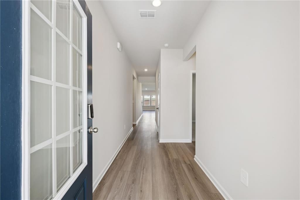 1499 High Fls Lane Grayson, GA 30017 - Photo 2 of 37 a view of hallway with wooden floor