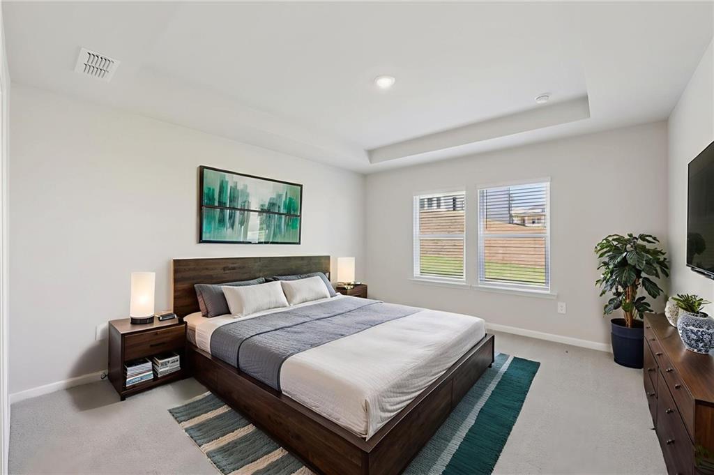 1499 High Fls Lane Grayson, GA 30017 - Photo 23 of 37 a bedroom with a bed table and a window