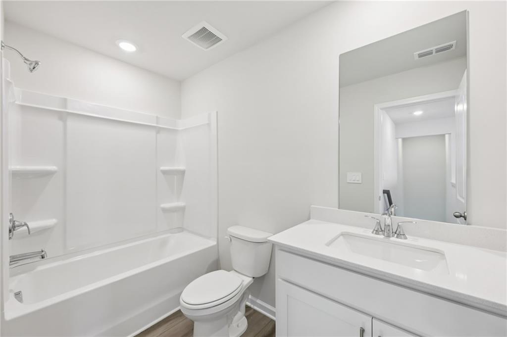 1499 High Fls Lane Grayson, GA 30017 - Photo 31 of 37 a bathroom with a sink toilet and shower