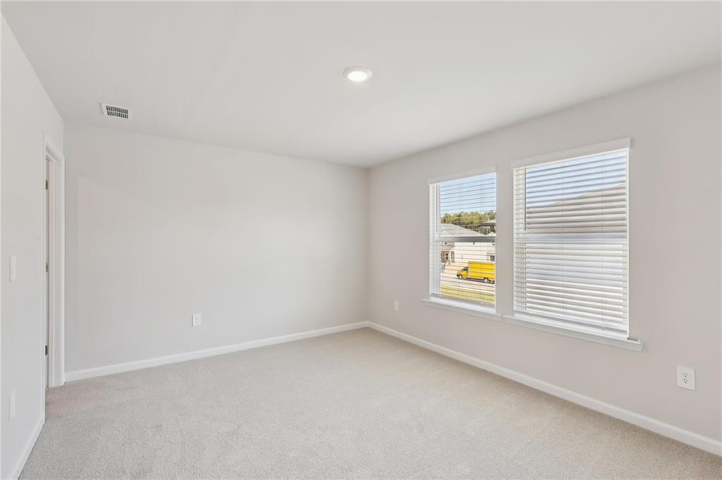 1499 High Fls Lane Grayson, GA 30017 - Photo 32 of 37 an empty room with a window