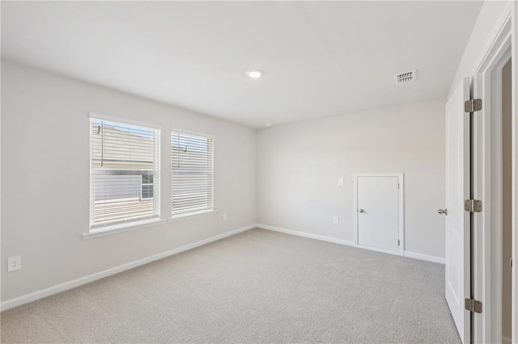 1499 High Fls Lane Grayson, GA 30017 - Photo 33 of 37 a view of an empty room with a window