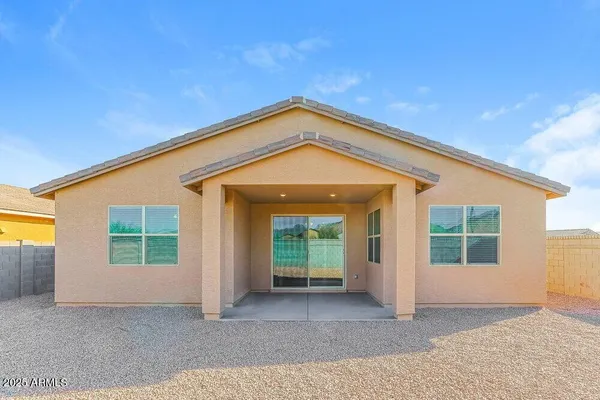 a view of a house with large windows