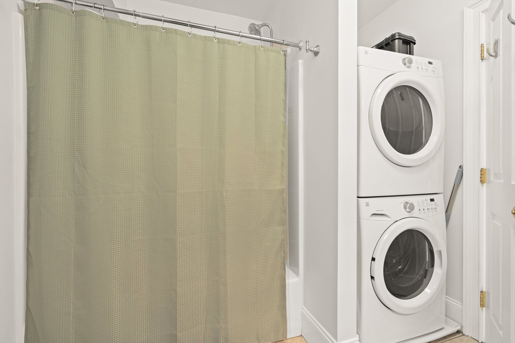 17 Robbins Street, Unit 22 Waltham, MA 02453 - Photo 14 of 27 a utility room with dryer and washer