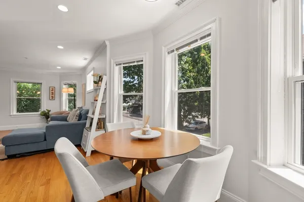a view of a dining room with furniture and window