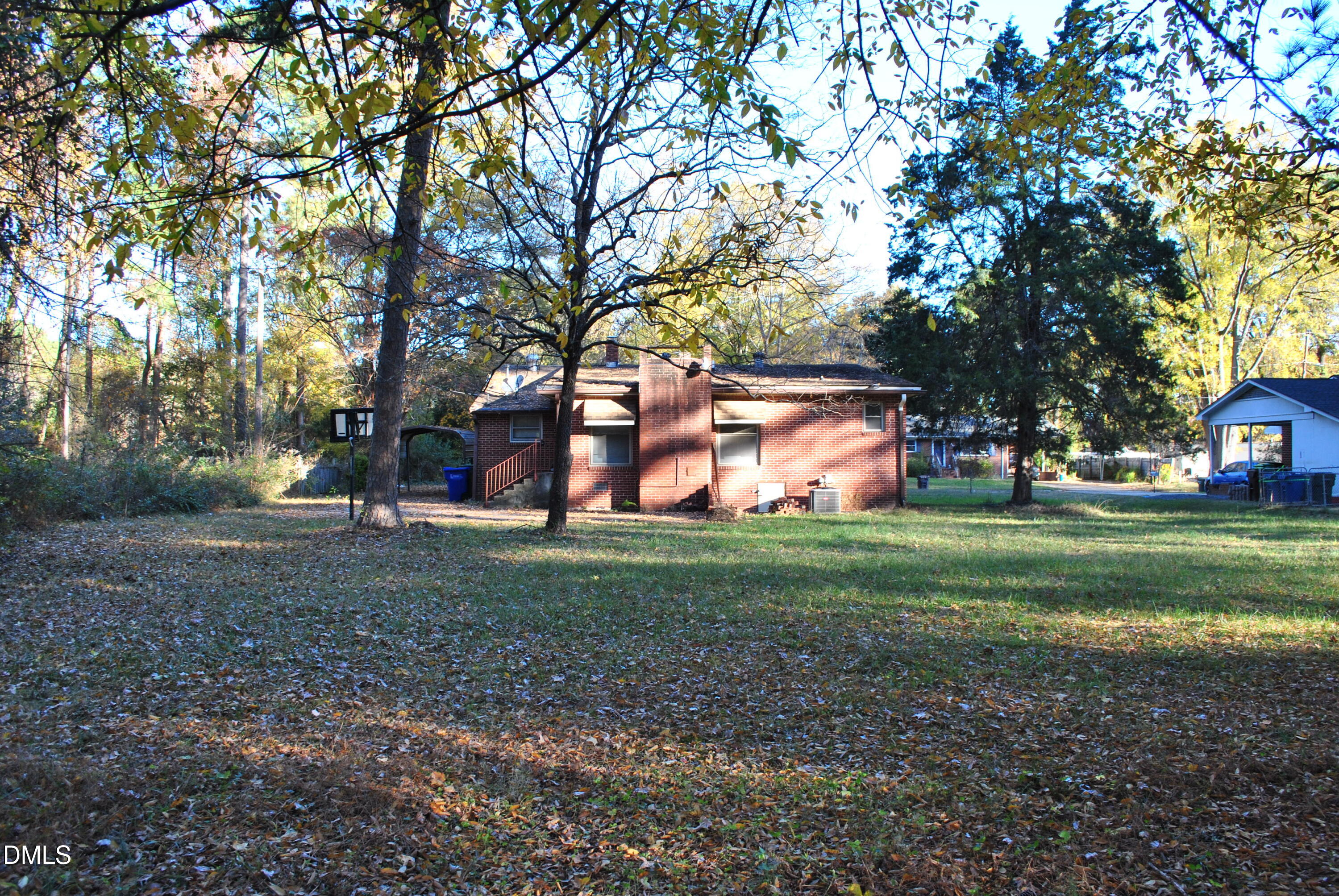 717 Crosby Road Durham, NC 27704 - Photo 13 of 15 a backyard of a house with lots of green space