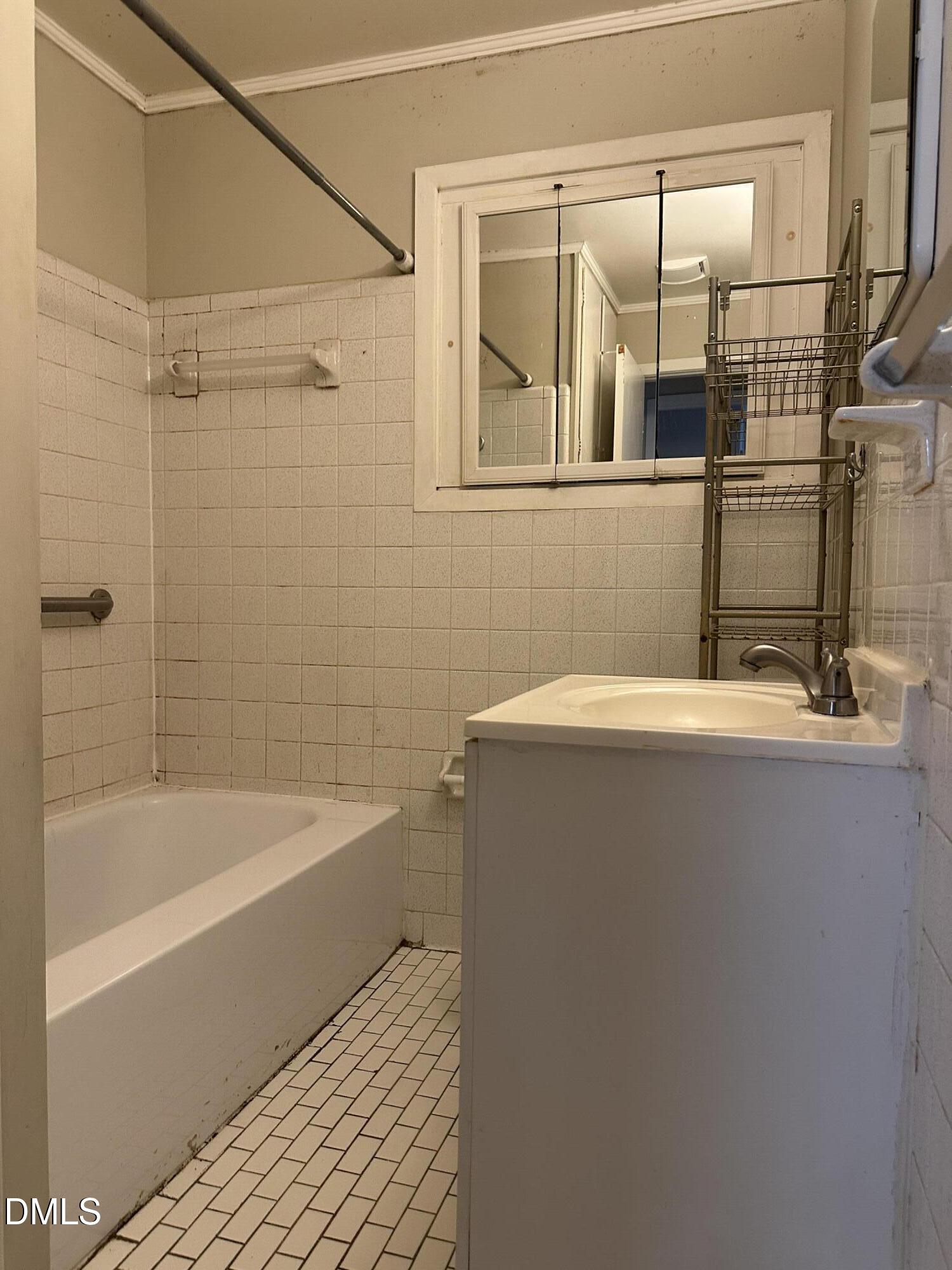 717 Crosby Road Durham, NC 27704 - Photo 10 of 15 a bathroom with a sink and a bathtub