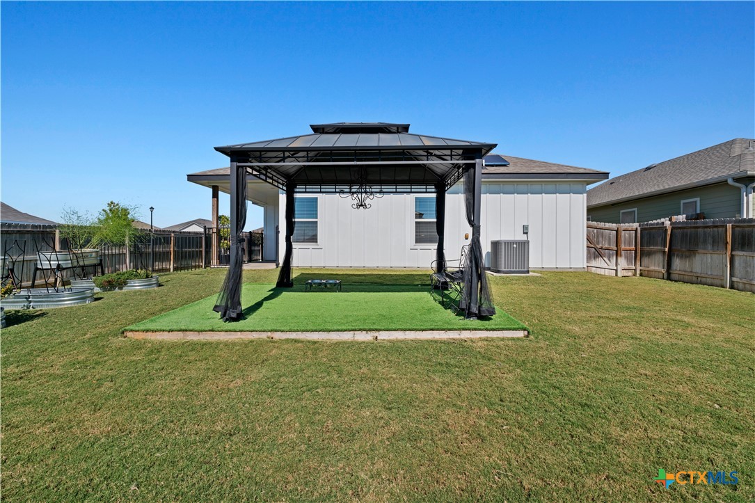 7619 McCulloch Road Temple, TX 76502 - Photo 28 of 31 Fenced backyard featuring a gazebo