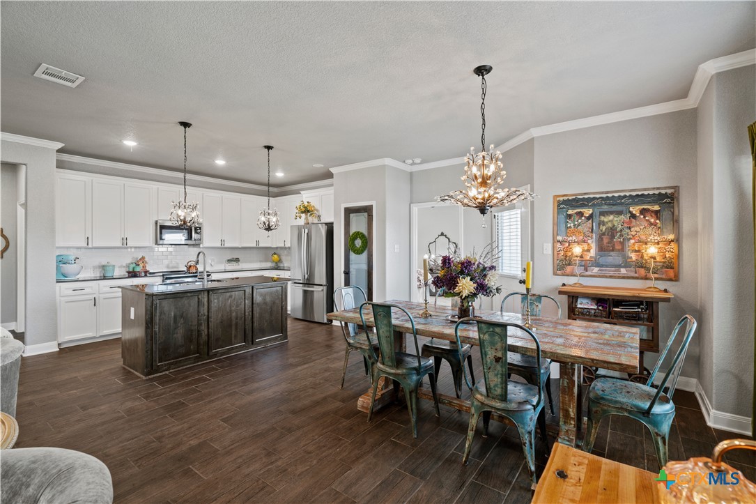 7619 McCulloch Road Temple, TX 76502 - Photo 3 of 31 Dining room with a added chandelier