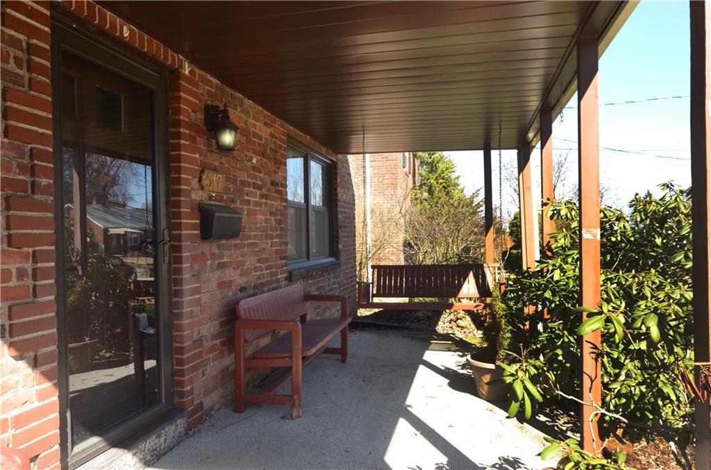 517 Old Farm Road Pittsburgh, PA 15234 - Photo 2 of 24 Long covered porch, a great spot to enjoy morning coffee!