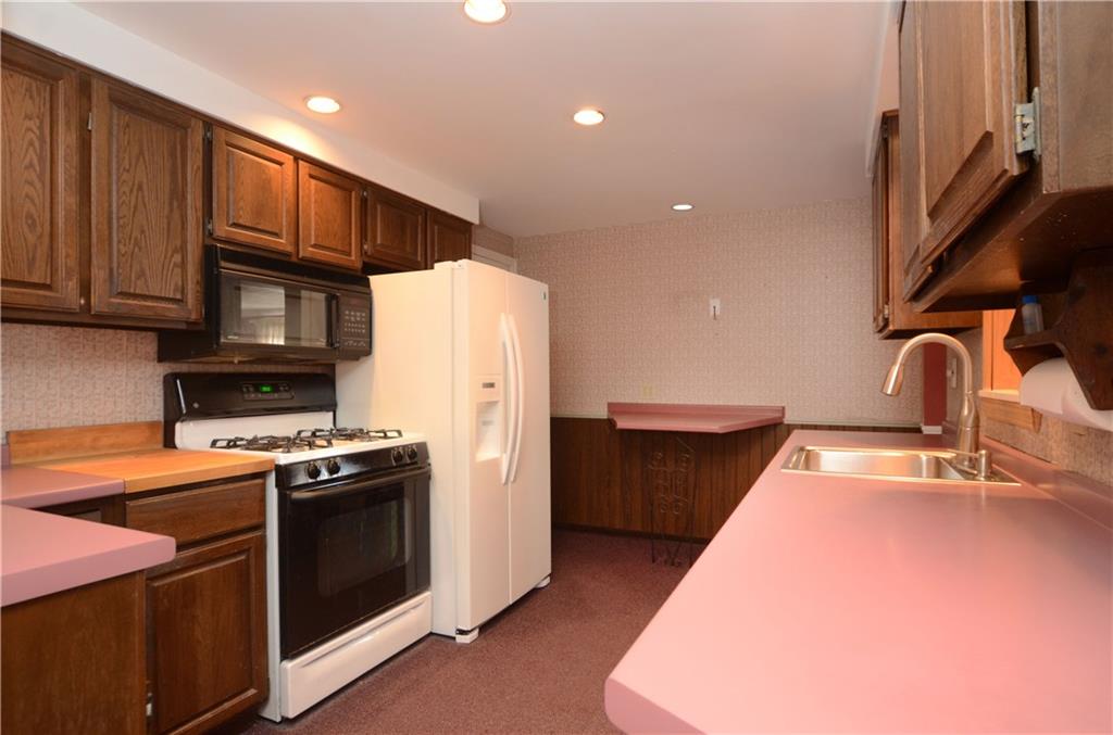 517 Old Farm Road Pittsburgh, PA 15234 - Photo 6 of 24 Kitchen features recessed lighting, gas stove & butcher block