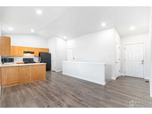 a view of kitchen with wooden floor