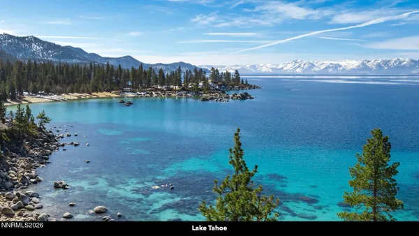 an aerial view of a house with yard