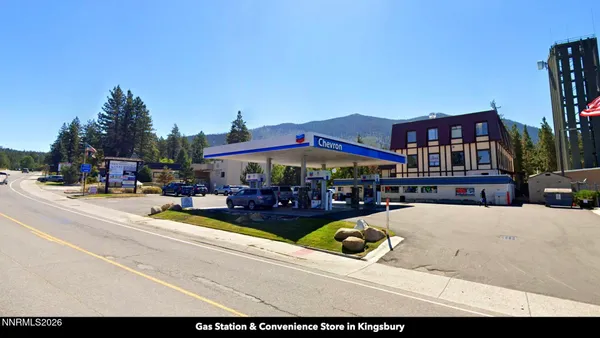 a view of an ocean with a mountain in the background