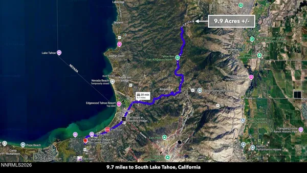 a sign that is sitting on a brick wall