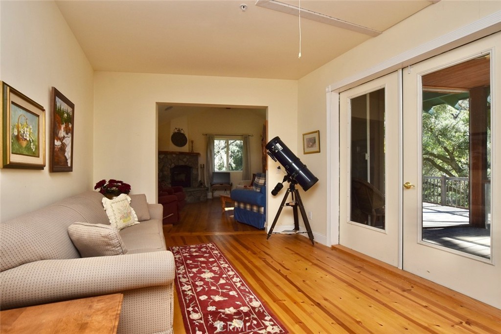 76450 Deer Pass Road Bradley, CA 93426 - Photo 11 of 50 a living room with furniture and a wooden floor