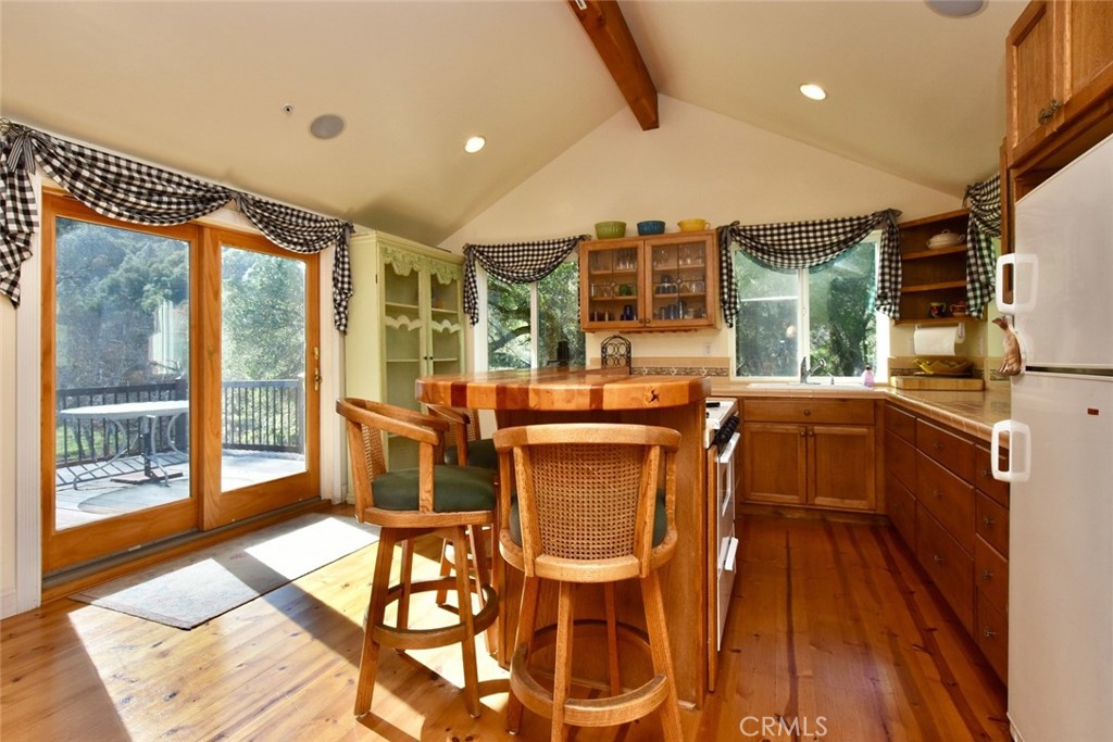 76450 Deer Pass Road Bradley, CA 93426 - Photo 15 of 50 a view of a dining room with furniture wooden floor and windows