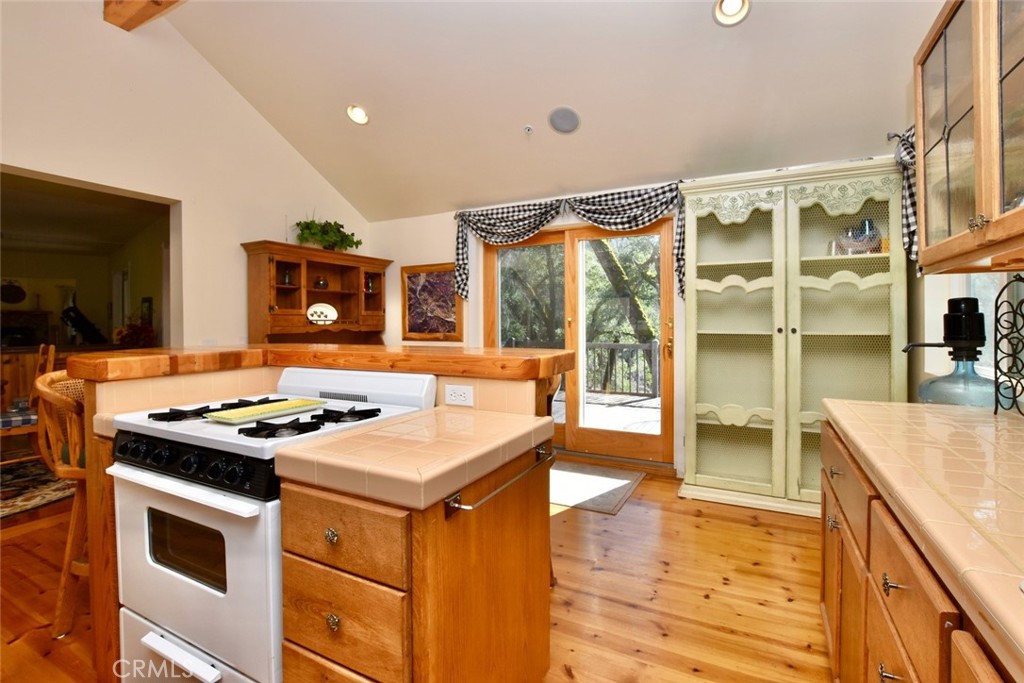76450 Deer Pass Road Bradley, CA 93426 - Photo 17 of 50 a kitchen with stainless steel appliances granite countertop a stove and a sink
