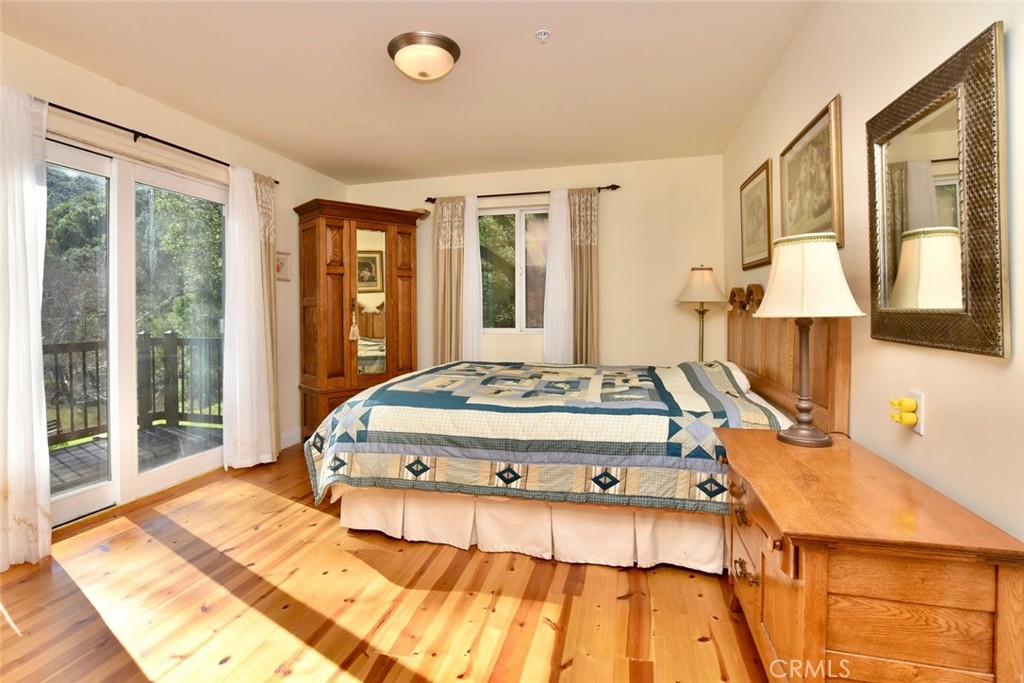 76450 Deer Pass Road Bradley, CA 93426 - Photo 19 of 50 a bedroom with a bed and wooden floor