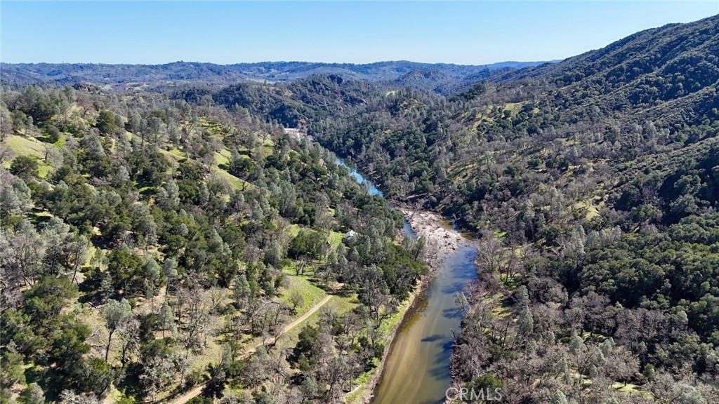 76450 Deer Pass Road Bradley, CA 93426 - Photo 2 of 50 an aerial view of residential house with green field and mountains