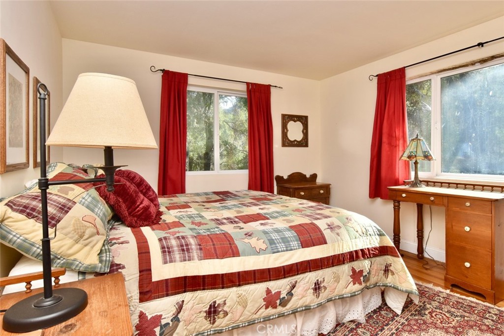 76450 Deer Pass Road Bradley, CA 93426 - Photo 22 of 50 a bedroom with a bed and a window