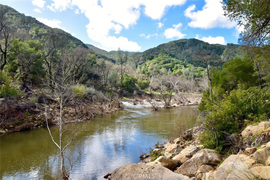 76450 Deer Pass Road Bradley, CA 93426 - Photo 37 of 50 a view of a lake with a mountain in the background