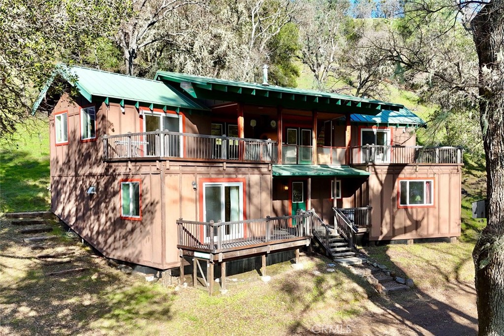 76450 Deer Pass Road Bradley, CA 93426 - Photo 4 of 50 a front view of a house with a yard table and chairs