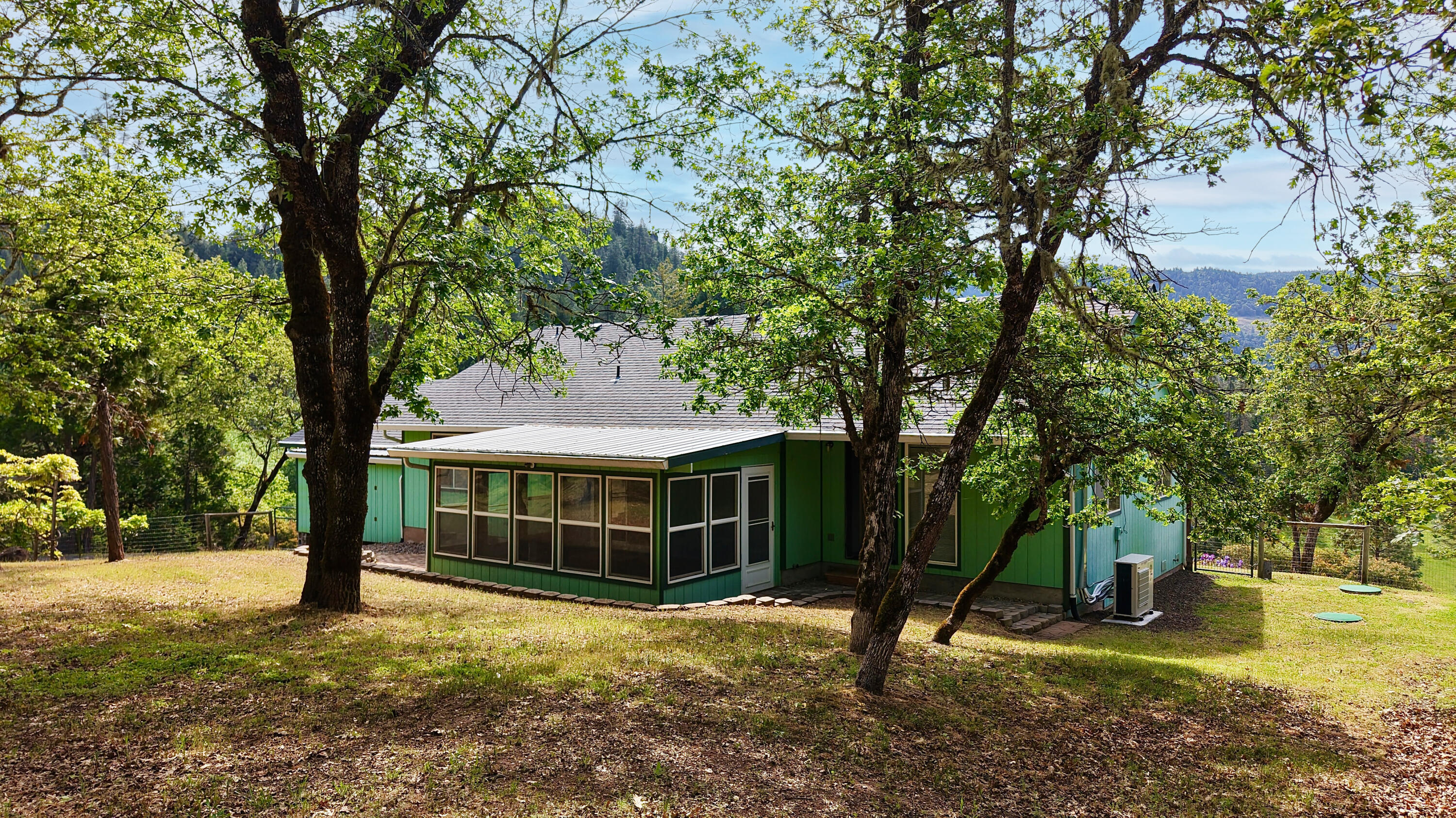 204 Shipley Terrace Prospect, OR 97536 - Photo 54 of 61 a view of a house with garden and trees