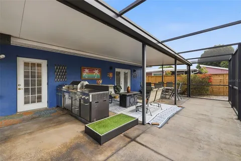 a view of a patio with a table and chairs