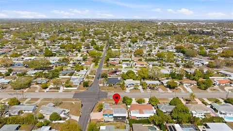 an aerial view of residential building and lake