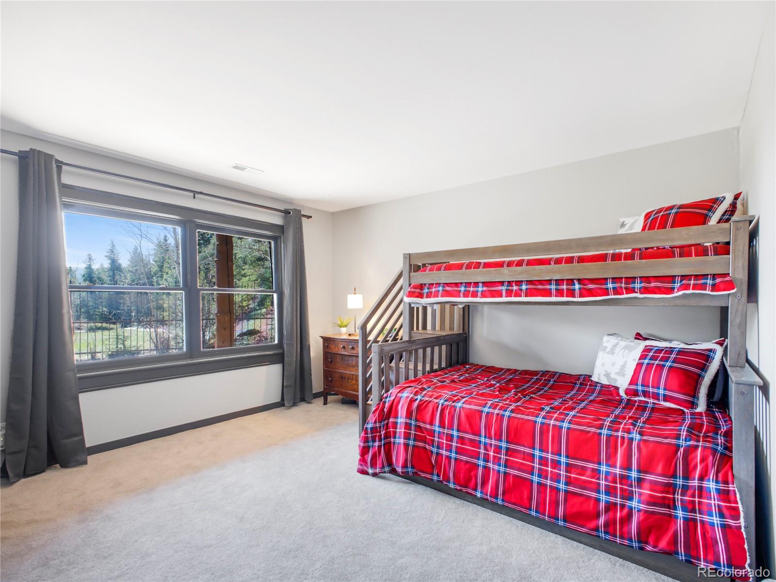 24 Pine Valley Road Evergreen, CO 80439 - Photo 24 of 50 a bedroom with a bed and window