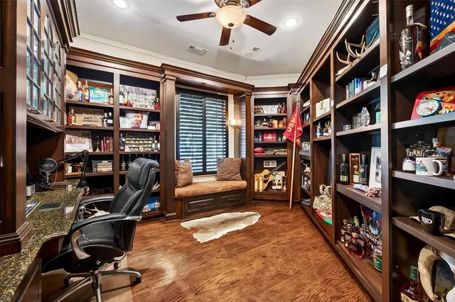a spacious bedroom with a bed and a flat screen tv