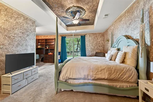 a spacious bathroom with a granite countertop sink a mirror and a shower