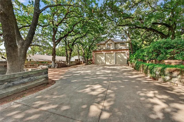 a living room with furniture ceiling fan and a large window