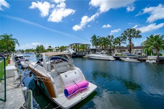 a view of a lake with couches chairs