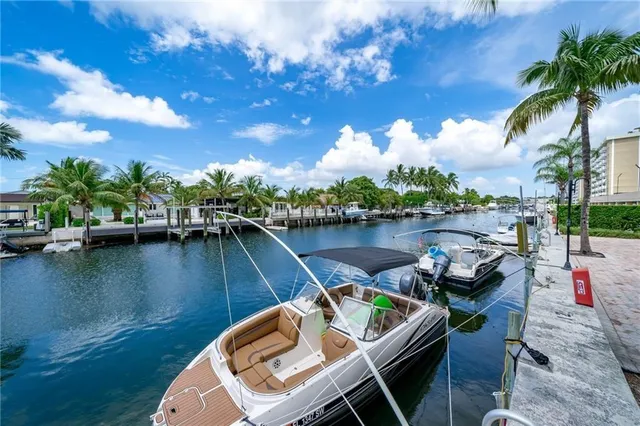 a view of a lake with couches chairs