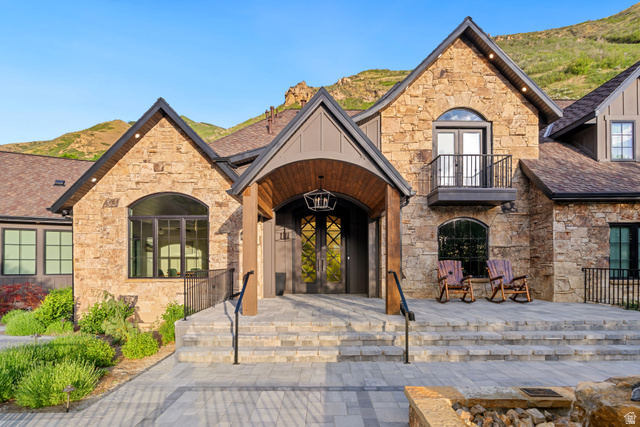 1141 South Oak Leaf Lane Springville, UT 84663 - Photo 4 of 147 Stone and wood-clad exterior with a prominent arched entry