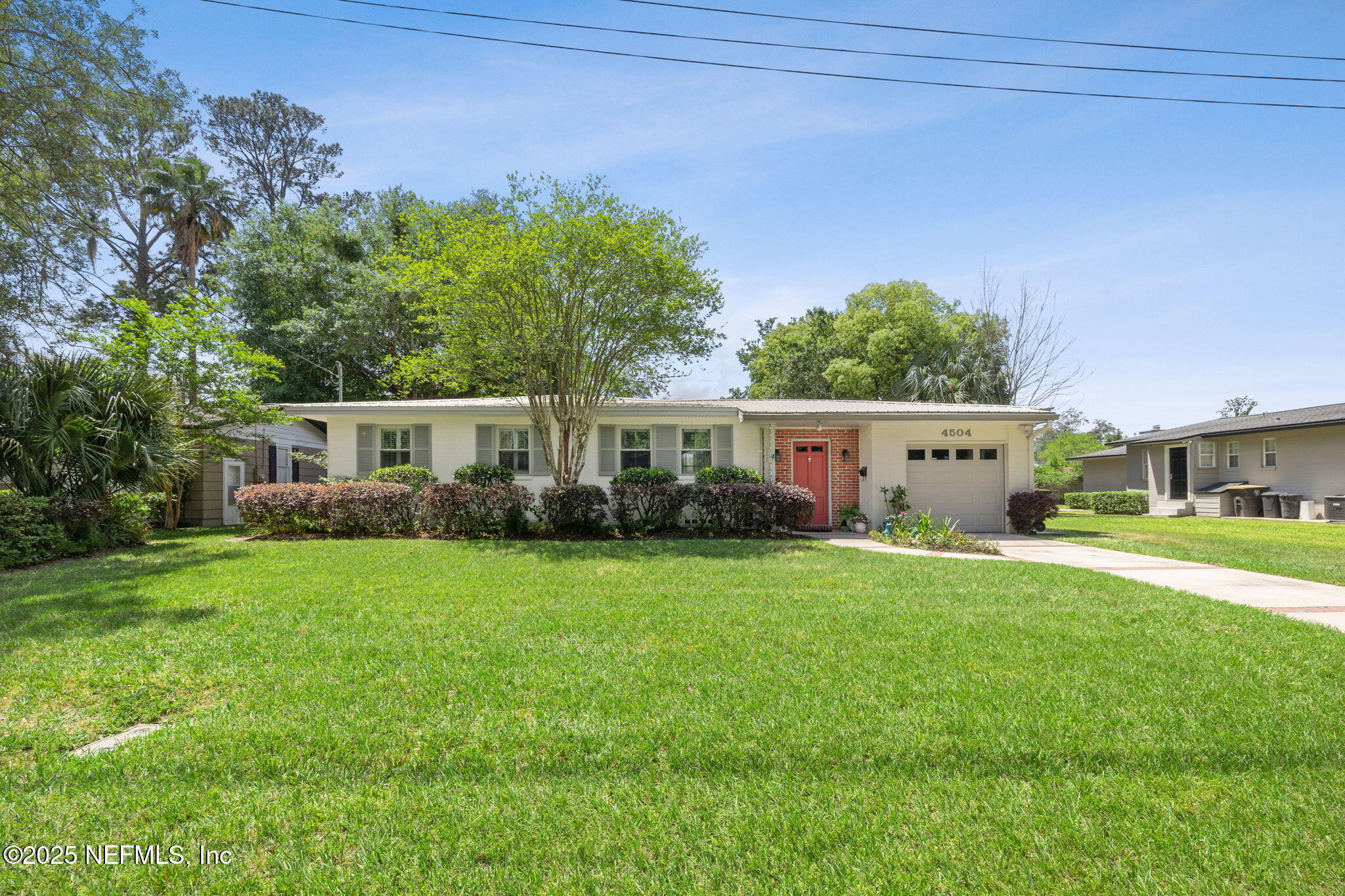 4504 Milstead Road Jacksonville, FL 32210 - Photo 4 of 33 a front view of house with yard and green space