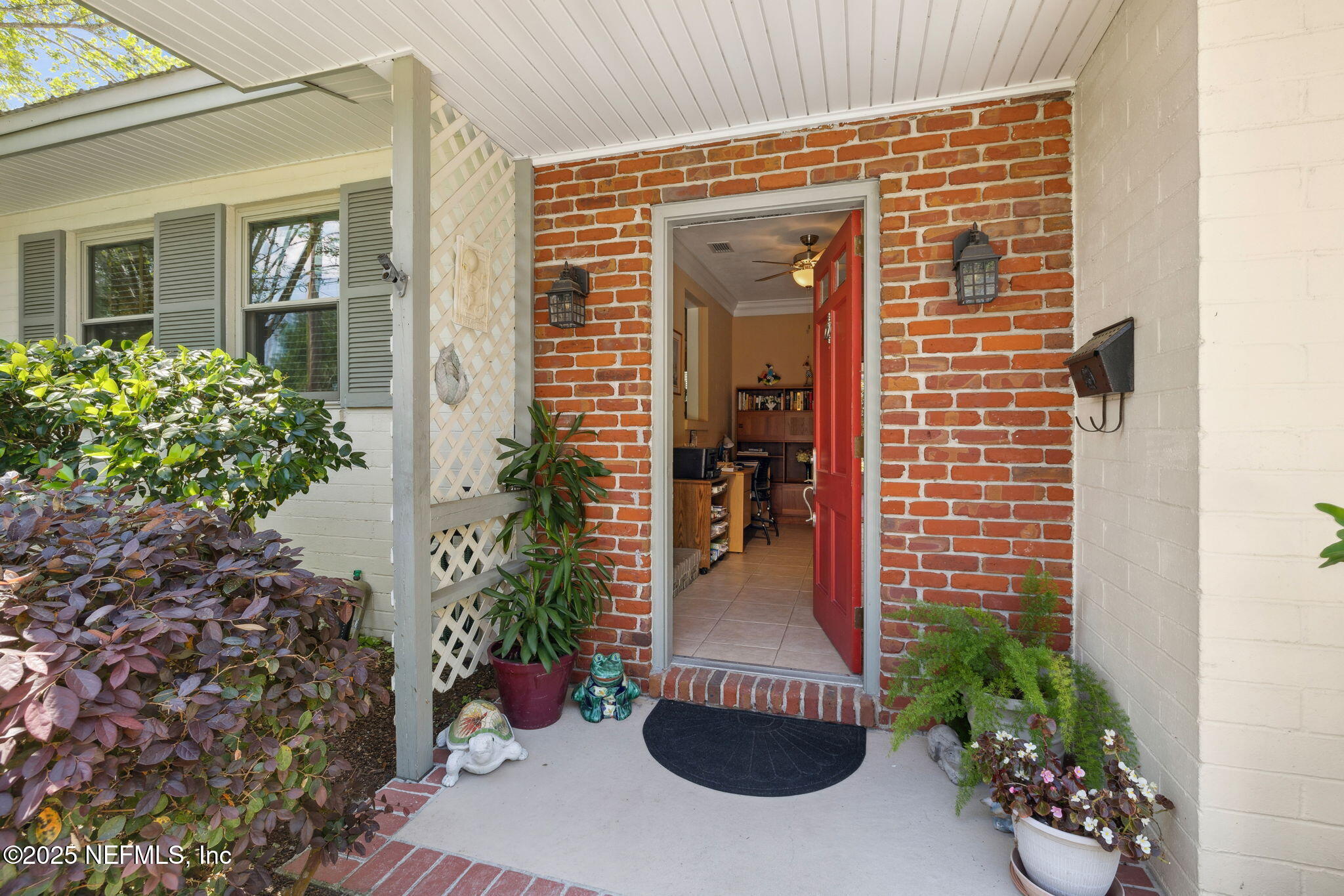 4504 Milstead Road Jacksonville, FL 32210 - Photo 6 of 33 front view of a house with a potted plant