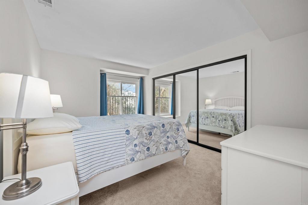 368 Hemlock Avenue Carlsbad, CA 92008 - Photo 23 of 32 a bedroom with a large bed and a large window