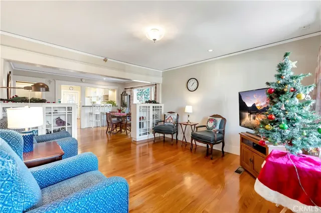 a living room with furniture and flowers